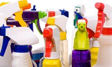 image of different colored plastic cleaning bottles