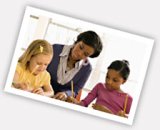 Photo of a teacher and two young students