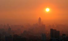 image of sun shining through hazy air